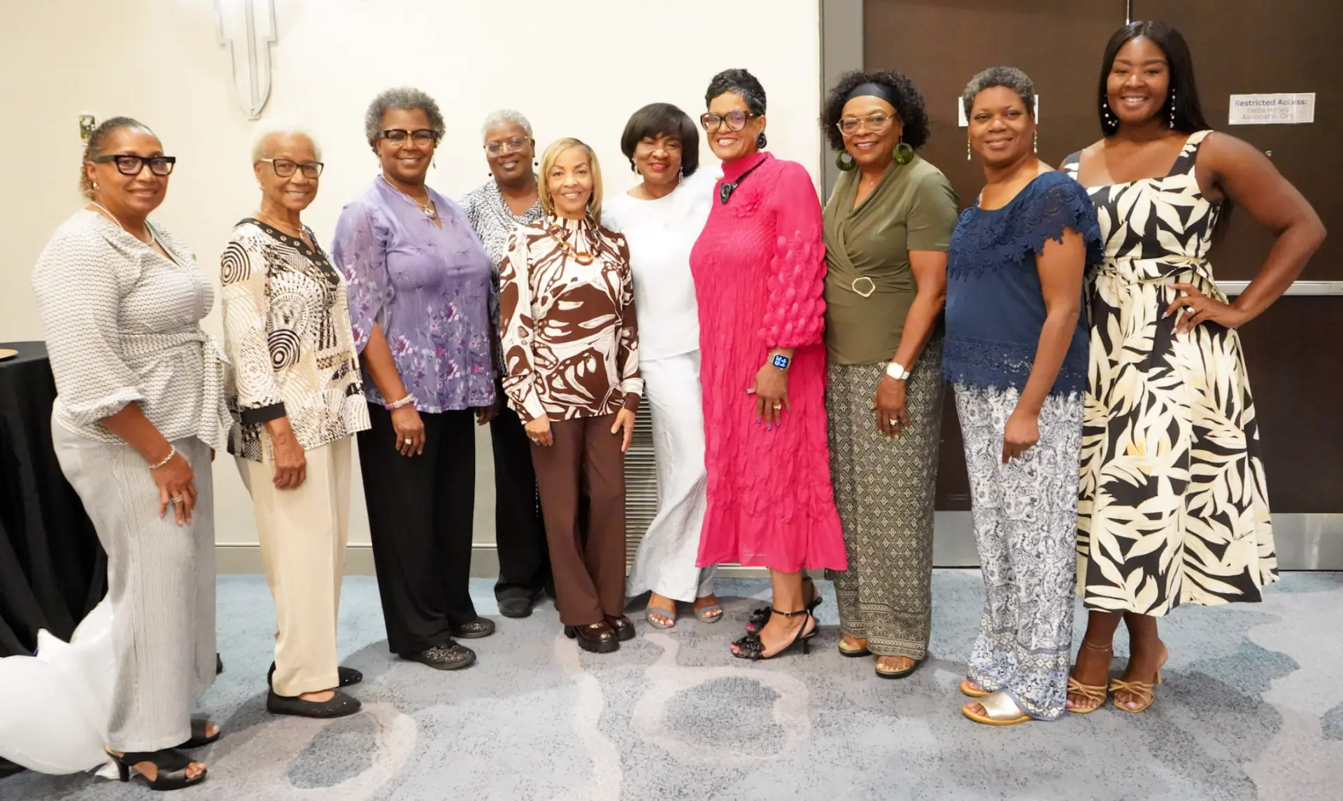 Dr. Lucretia with a group of women at the empowerment breakfast