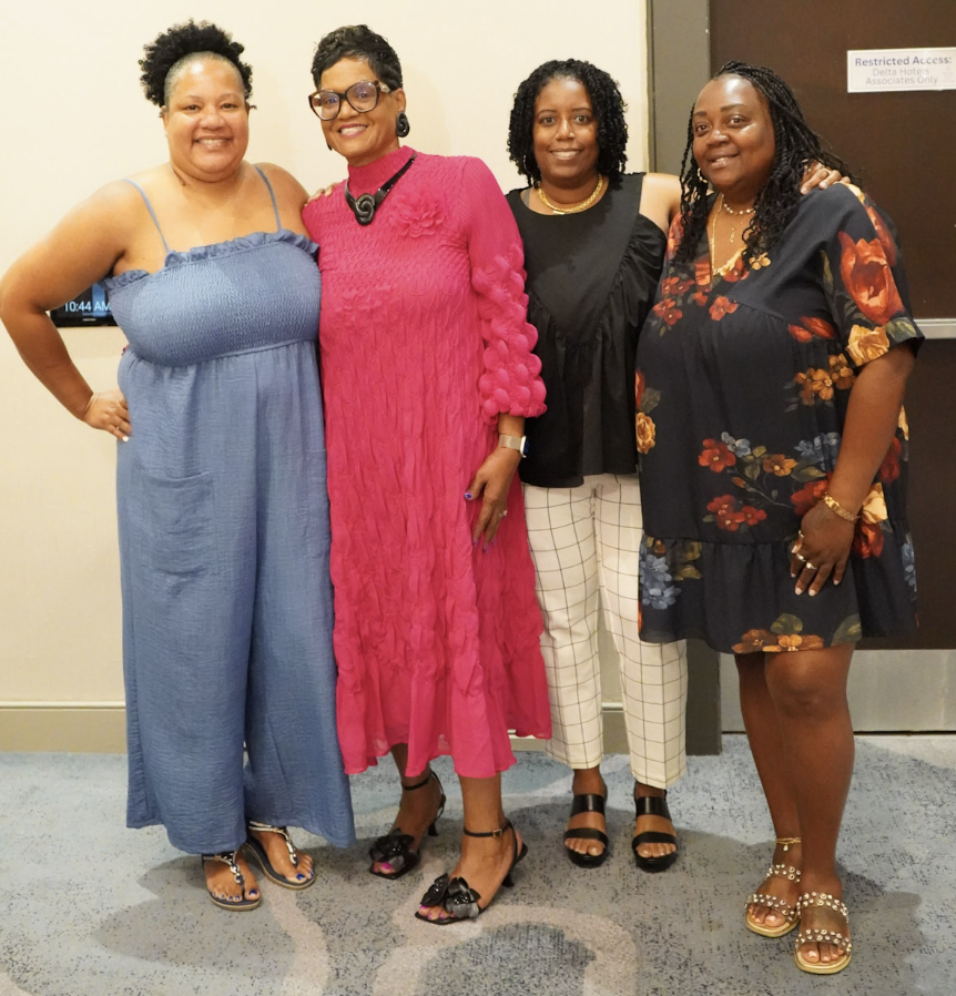 Dr. Lucretia with attendees after a session