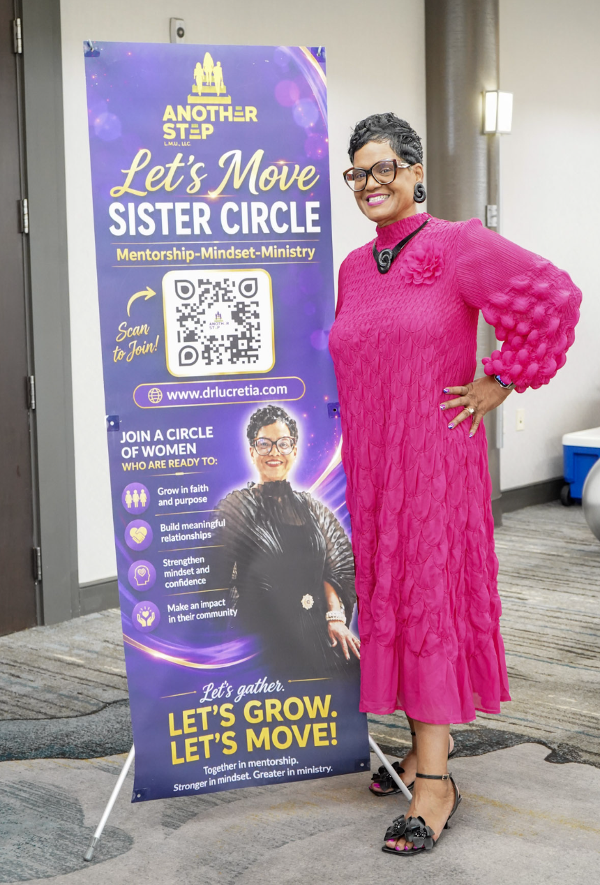 Dr. Lucretia Mason-Underdue beside the Let's Move Sister Circle banner